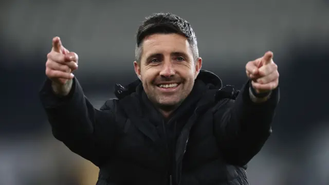Alan Sheehan points with both hands
