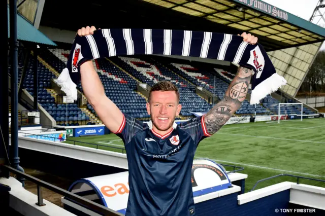 Lee Ashcroft holds Raith Rovers scarf above his head