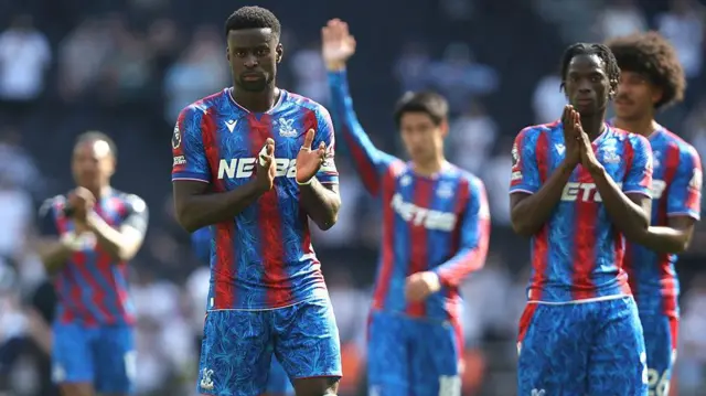 Palace players applauding their away support