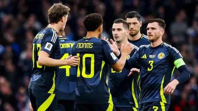 Scotland's Che Adams celebrates with Andy Robertson after scoring to make it 1-0