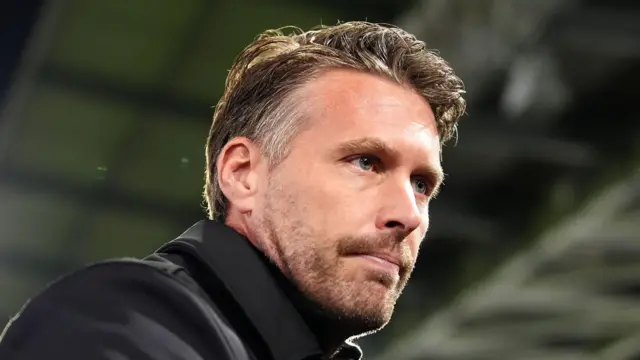 A close-up photo of Rob Edwards