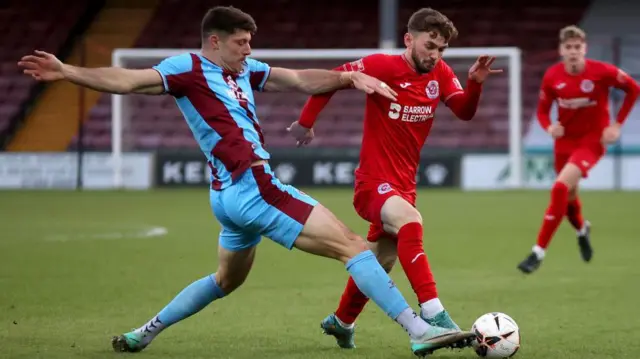 Will Evans of Scunthorpe United makes a tackle