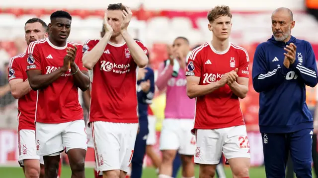 Nottingham Forest players and manager Nuno applaud supporters