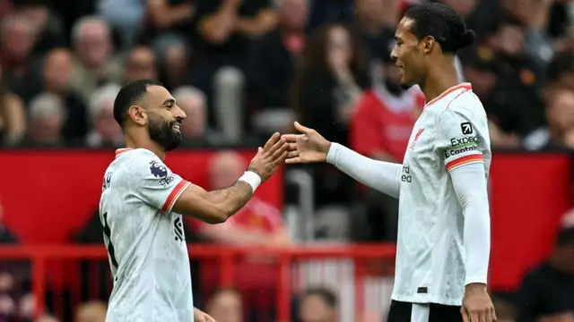 Mohamed Salah and Virgil van Dijk celebrate