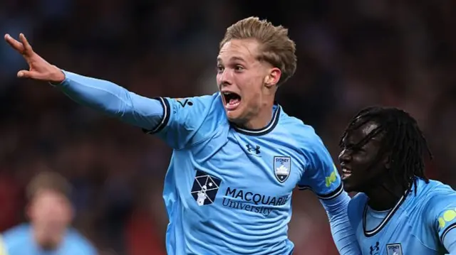 Sydney FC's Joe Lacey celebrates scoring against Wrexham