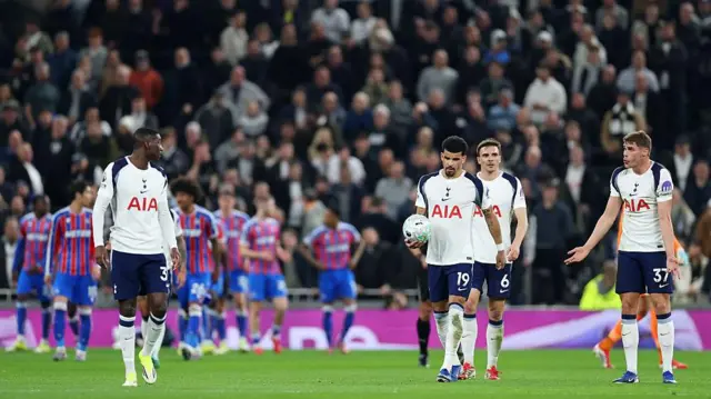 Tottenham players look dejected on the pitch during the defeat by Crystal Palace