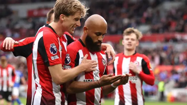 Bryan Mbeumo celebrates with his Brentford team-mates after scoring against Ipswich Town