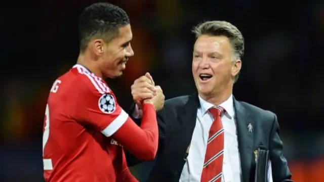 Chris Smalling celebrates with Louis van Gaal