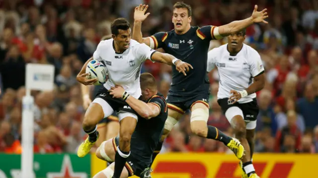 Ben Volavola is tackled by Dan Lydiate