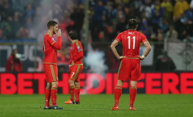 Wales' players stand dejected