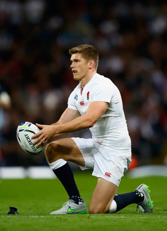 Owen Farrell places the ball