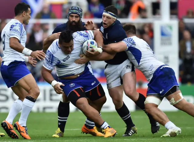 Census Johnston battles with the ball for Samoa