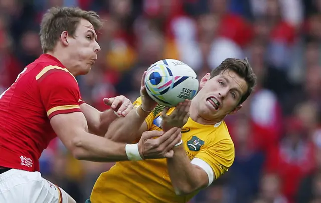 Liam Williams attempts to tackle Bernard Foley