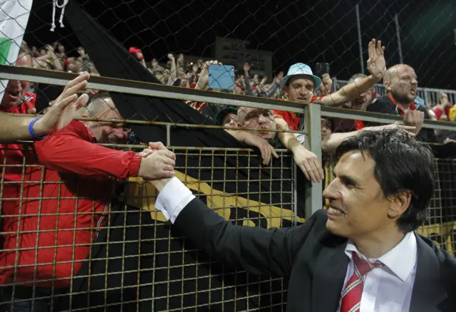Chris Coleman celebrates with the Wales fans