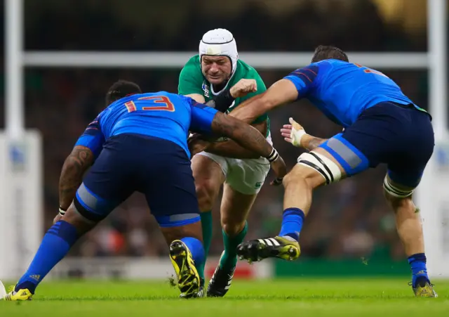 Rory Best gets tackled