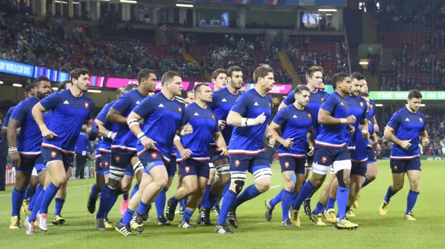 France warm up ahead of the match