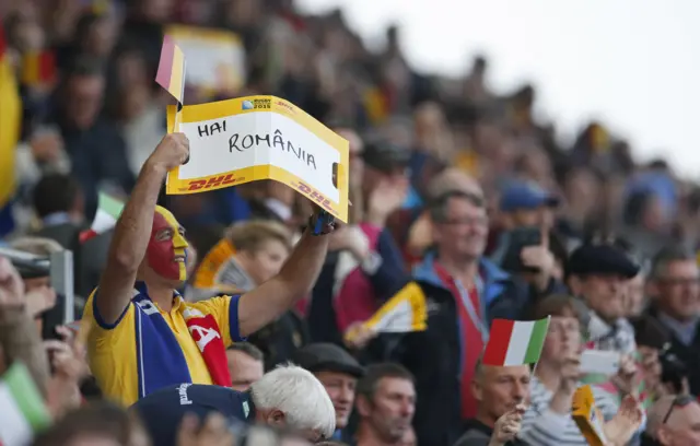 A Romanian fan supports his team