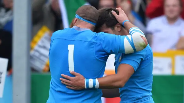 Italy players celebrate