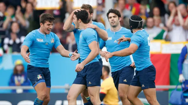 Italy celebrate scoring their try