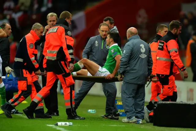 Shane Long is stretchered off