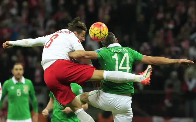 Jonathan Walters rises for the header