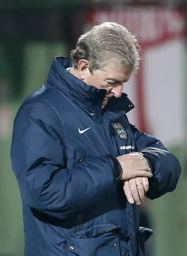 Roy Hodgson checks his watch