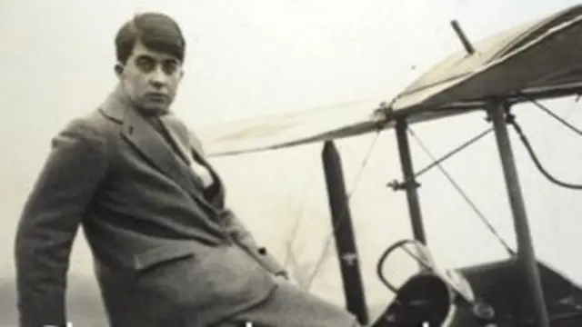 Constance Leathart sitting in the cockpit of a biplane