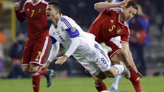 Israel's Beram Kayal is tackled by Belgium's Jan Vertonghen