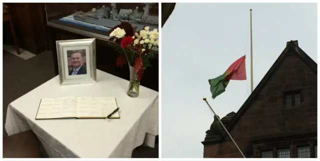 Book of condolence & flag at half mast