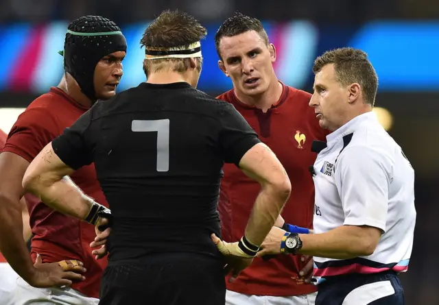 Nigel Owens speaks to both captains and Louis Picamoles