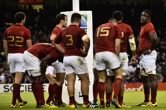 The France players look dejected