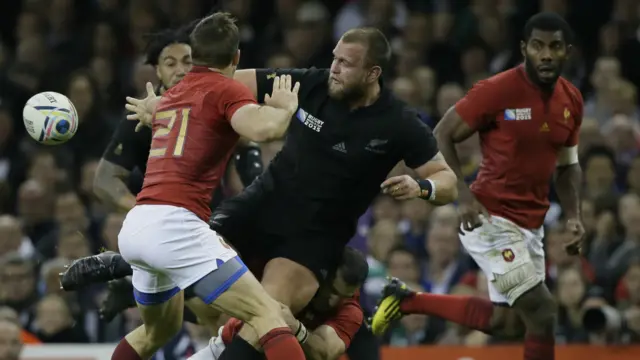 New Zealand forward Josh Moody passes the ball out of the back of his hand