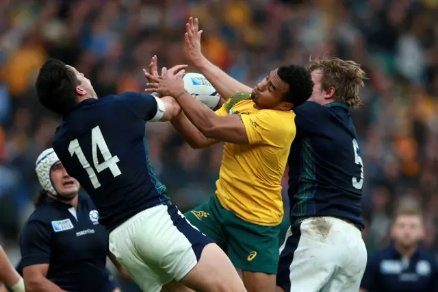 Will Genia jumps for the ball with Sean Maitland