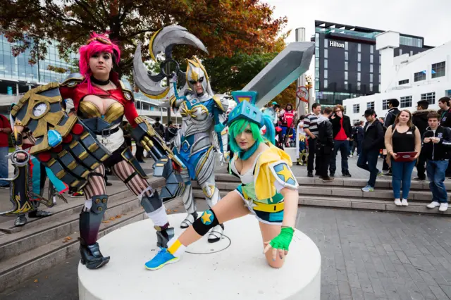 Cosplayers pose outside Wembley