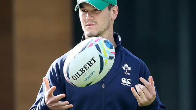 Jonathan Sexton watches on during the captain's run in Cardiff