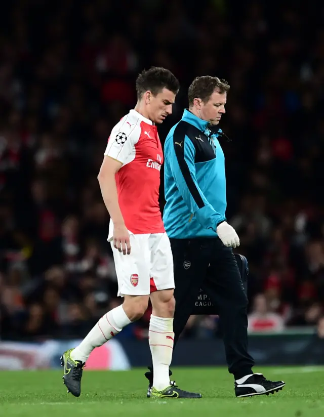 Laurent Koscielny limps off in Arsenal's match against Olympiakos