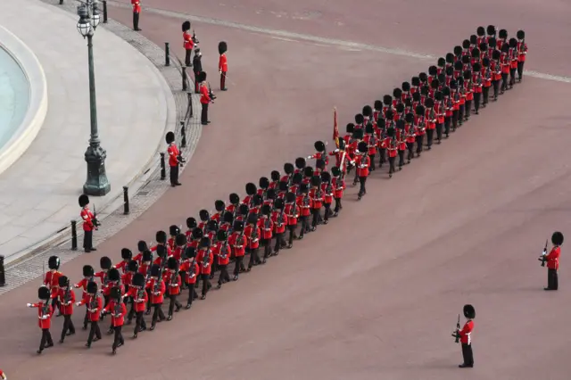 Guardsmen marching in front of Buckingham Palace