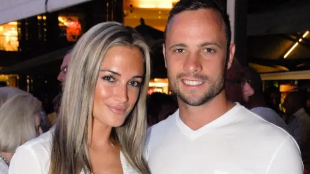 A picture taken on January 26, 2013 shows Olympian sprinter Oscar Pistorius posing next to his girlfriend Reeva Steenkamp at Melrose Arch in Johannesburg