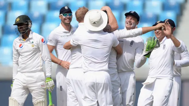 England celebrate the wicket of Shoaib Malik