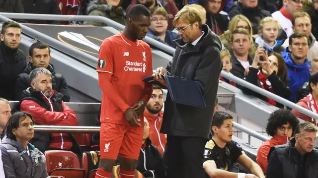 Christian Benteke prepares to come on