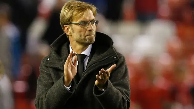 Juergen Klopp applauds fans at full-time