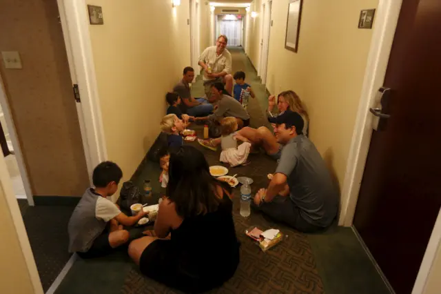 Tourists who arrived from Puerto Vallarta eat in a corridor of a hotel in Guadalajara, Mexico October 23, 2015.