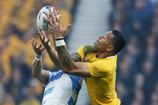 Israel Folau battles for the ball