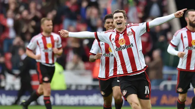 Adam Johnson celebrates