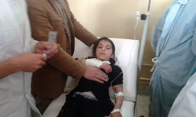 An Afghan schoolgirl injured in a stampede lays on a hospital bed after an earthquake hit Takhar Province