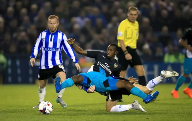 Arsenal's Glen Kamara is tackled