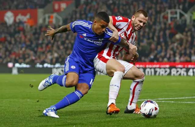 Chelsea's Kenedy fights for the ball with Stoke's Phil Bardsley