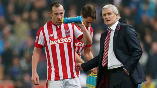 Charlie Adam and Mark Hughes