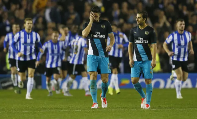 Olivier Giroud and Mathieu Flamini react to going 3-0 behind