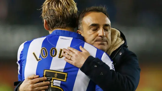 Sheffield Wednesday's Glen Loovens and manager Carlos Carvalhal celebrate at full-time